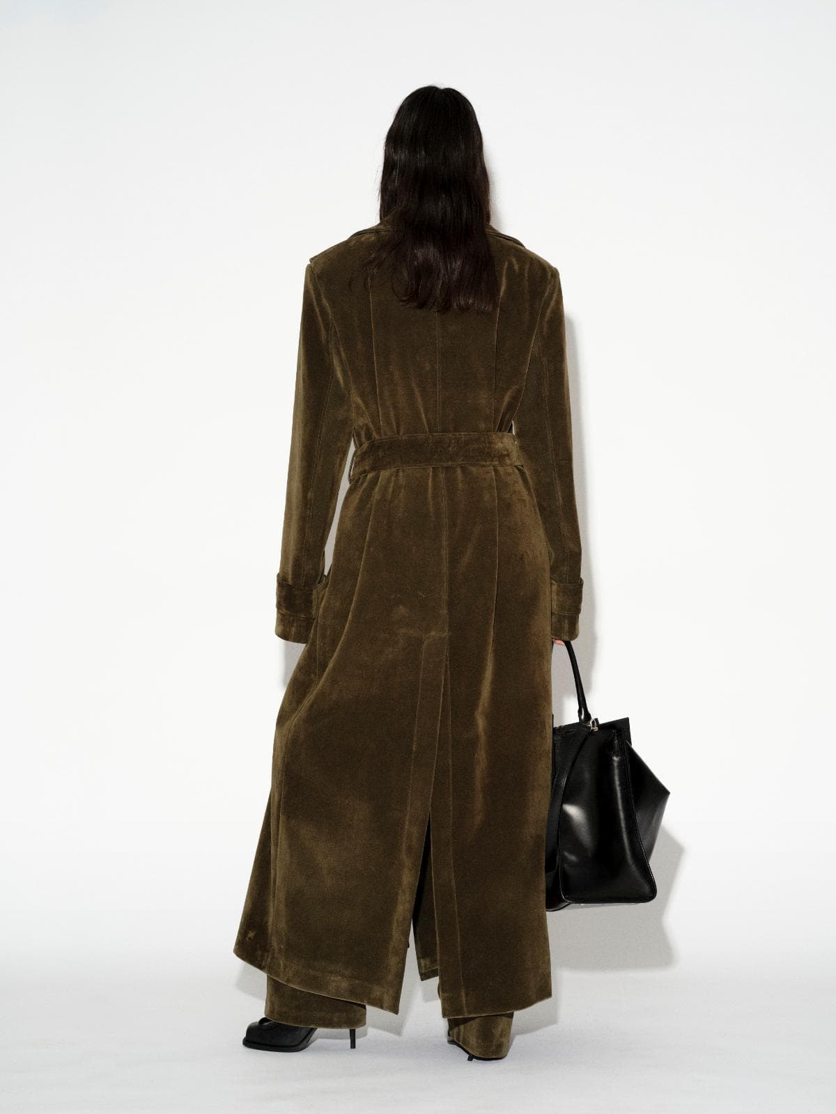 LAFORMELA Vintage Effect long olive velvet trench coat styled with oversized black luxury handbag MIXMVSE London