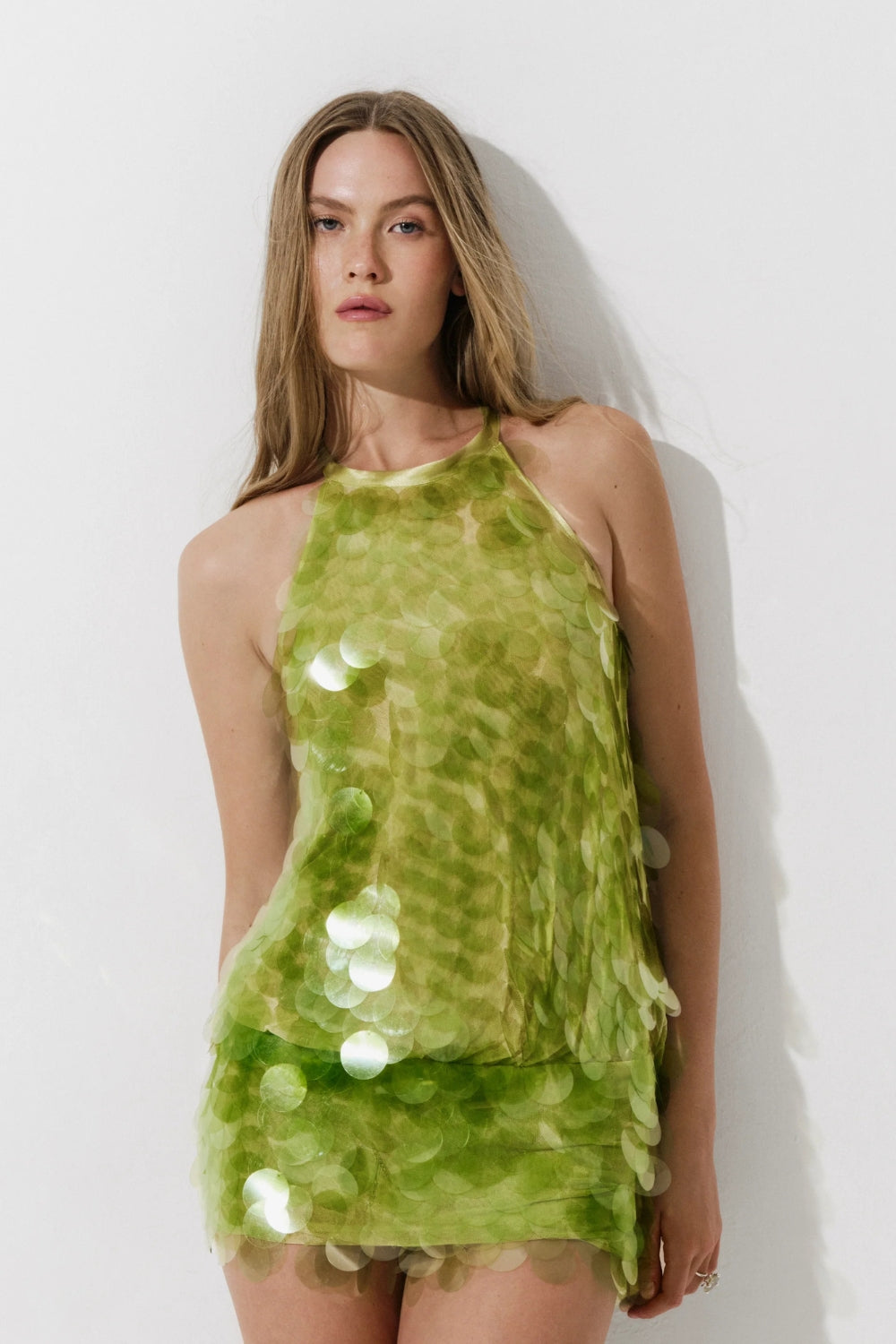 Cultnaked Matcha Jumpsuit in green. Detail view of halter neckline and zipper closure. Independent Ukrainian designer at MIXMVSE London.