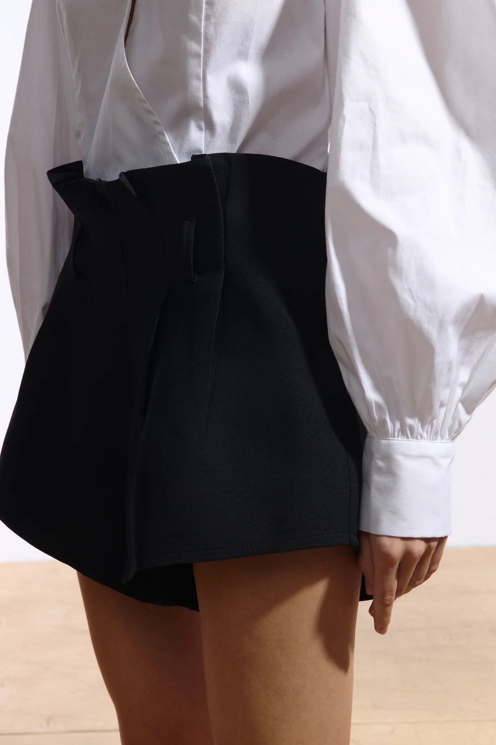 Ambitna black wool and silk mini shorts, styled full look. Independent Ukrainian designer at MIXMVSE London.