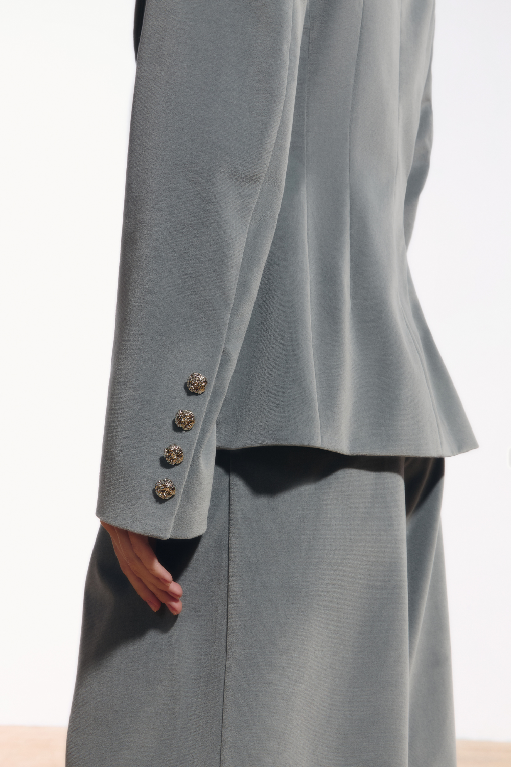 Ambitna velvet blazer in grey wool, side view showing the structured shoulder line. Independent Ukrainian designer at MIXMVSE London.