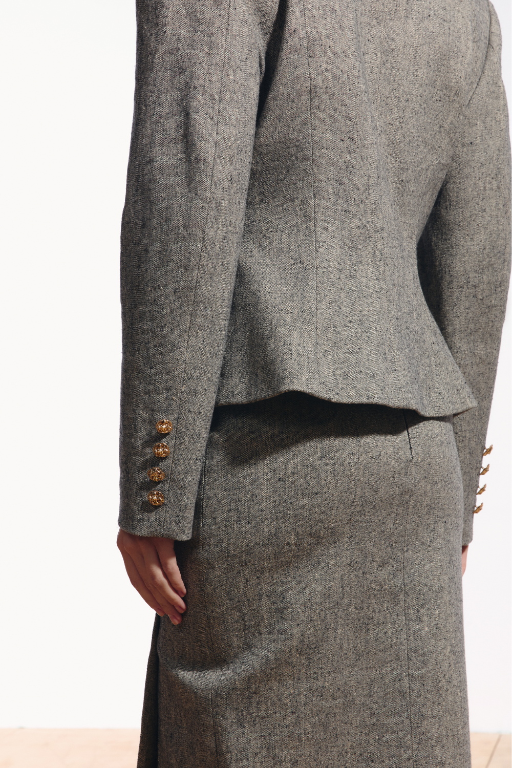 Ambitna grey tweed jacket, back view. Independent Ukrainian designer at MIXMVSE London.