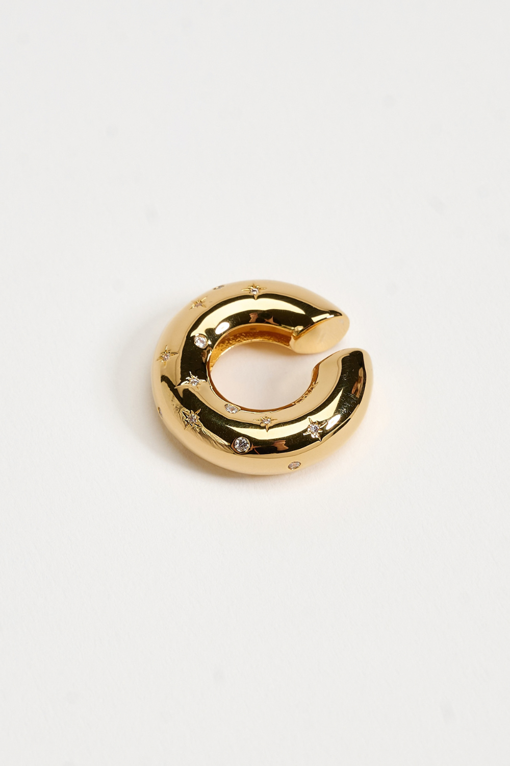 Chuk Raw Desire ear cuff in 18K gold-plated brass with cubic zirconia. Ukrainian designer jewellery at MIXMVSE London.