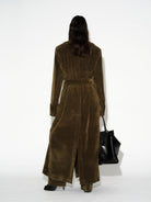 LAFORMELA Vintage Effect long olive velvet trench coat styled with oversized black luxury handbag MIXMVSE London