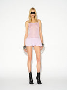 LAFORMELA pink sheer knitted mini dress styled with black leather boots and sunglasses MIXMVSE London