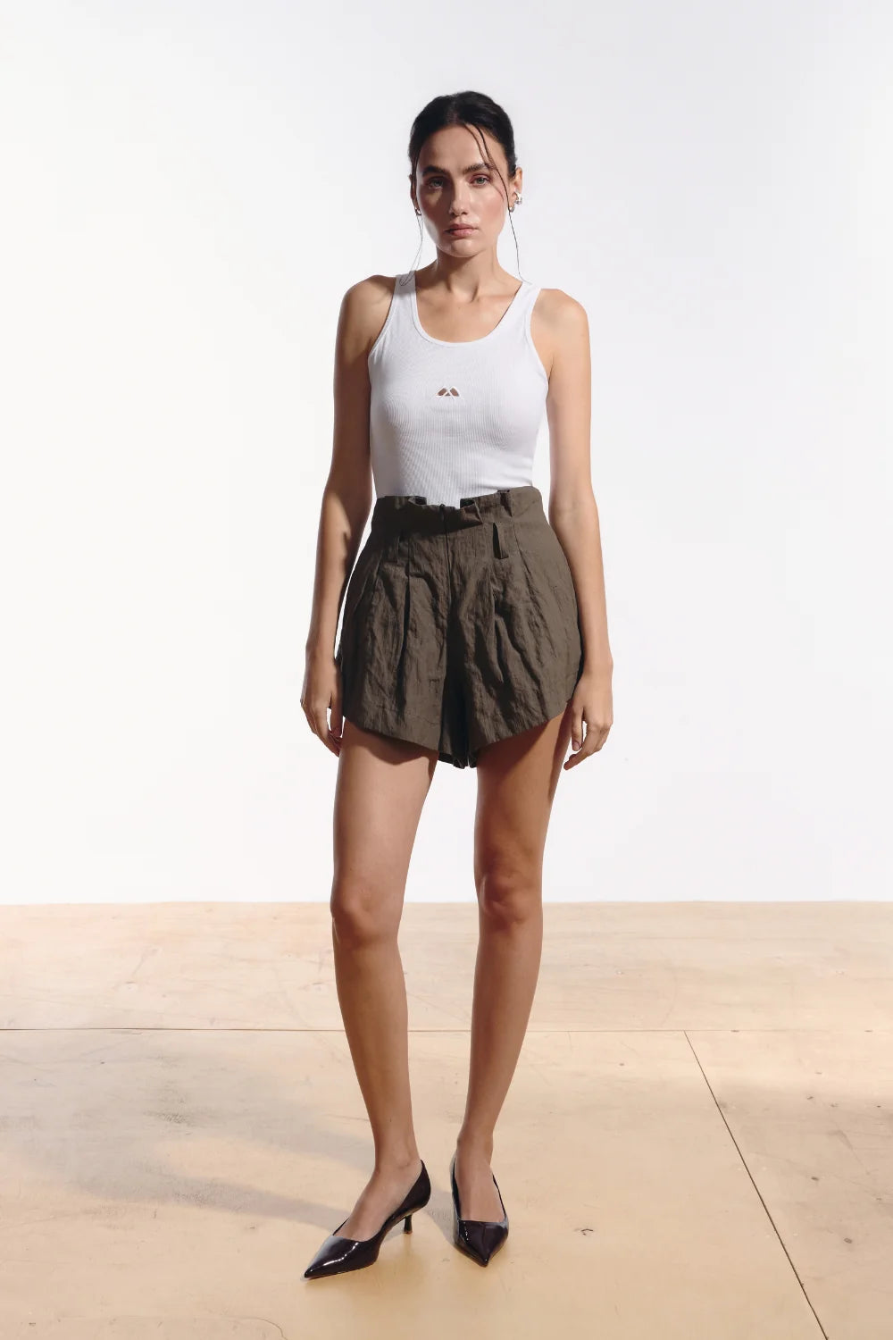 Ambitna crinkled mini shorts in khaki cotton, front view. Independent Ukrainian designer at MIXMVSE London.