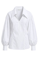 Ambitna white cotton shirt, detail of the straight point collar and buttoned cuff. Independent Ukrainian designer at MIXMVSE London.