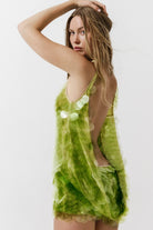 Cultnaked Matcha Jumpsuit in green recycled polyester. Side view showing built-in shorts construction. Available at MIXMVSE London concept store.