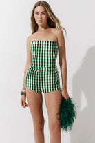 Cultnaked Vixen Shorts in green gingham. Side view of high-waisted mini shorts with zip and button fastening. Made in Ukraine, at MIXMVSE London.