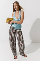 Cultnaked Barrel Pants in brown cotton-lyocell. Front view of barrel-leg trousers with front pockets. Independent Ukrainian designer at MIXMVSE London.