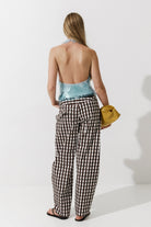 Cultnaked Barrel Pants in brown. Side view of barrel-leg silhouette with concealed zip. Made in Ukraine, at MIXMVSE London.