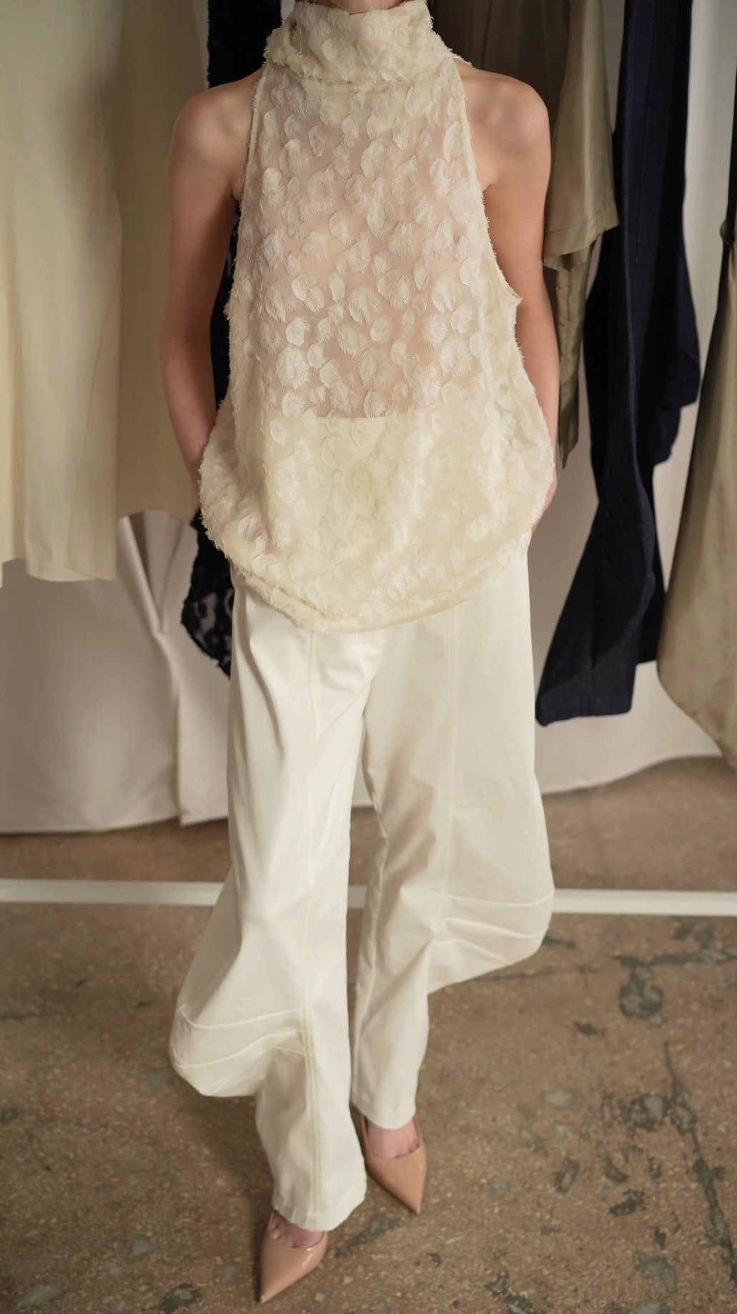 KARPOVA Semi-Sheer Turtleneck Top in white. Back view showing button fastening detail. Available at MIXMVSE London concept store.