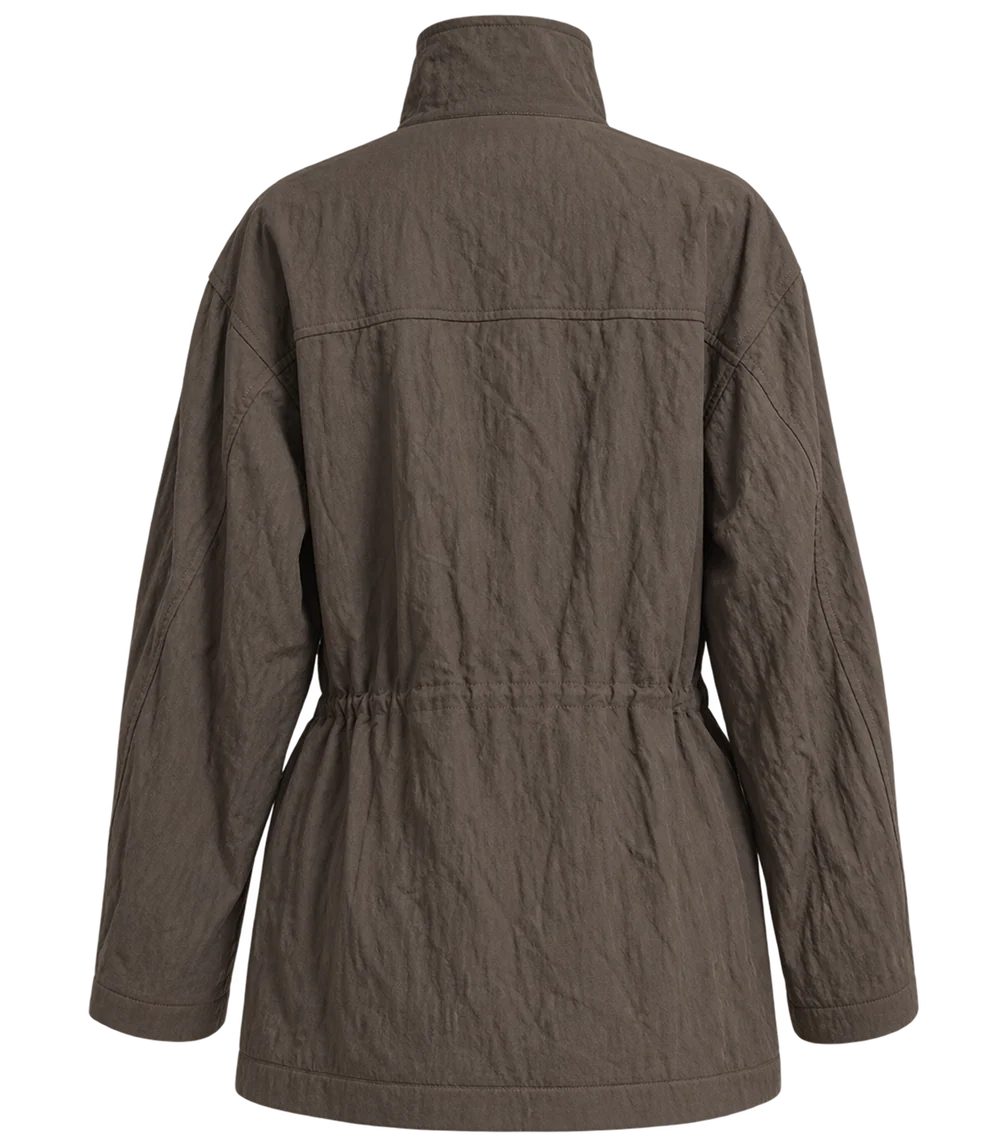 Ambitna crinkled khaki jacket, detail of the buttoned front and crinkled cotton. Independent Ukrainian designer at MIXMVSE London.