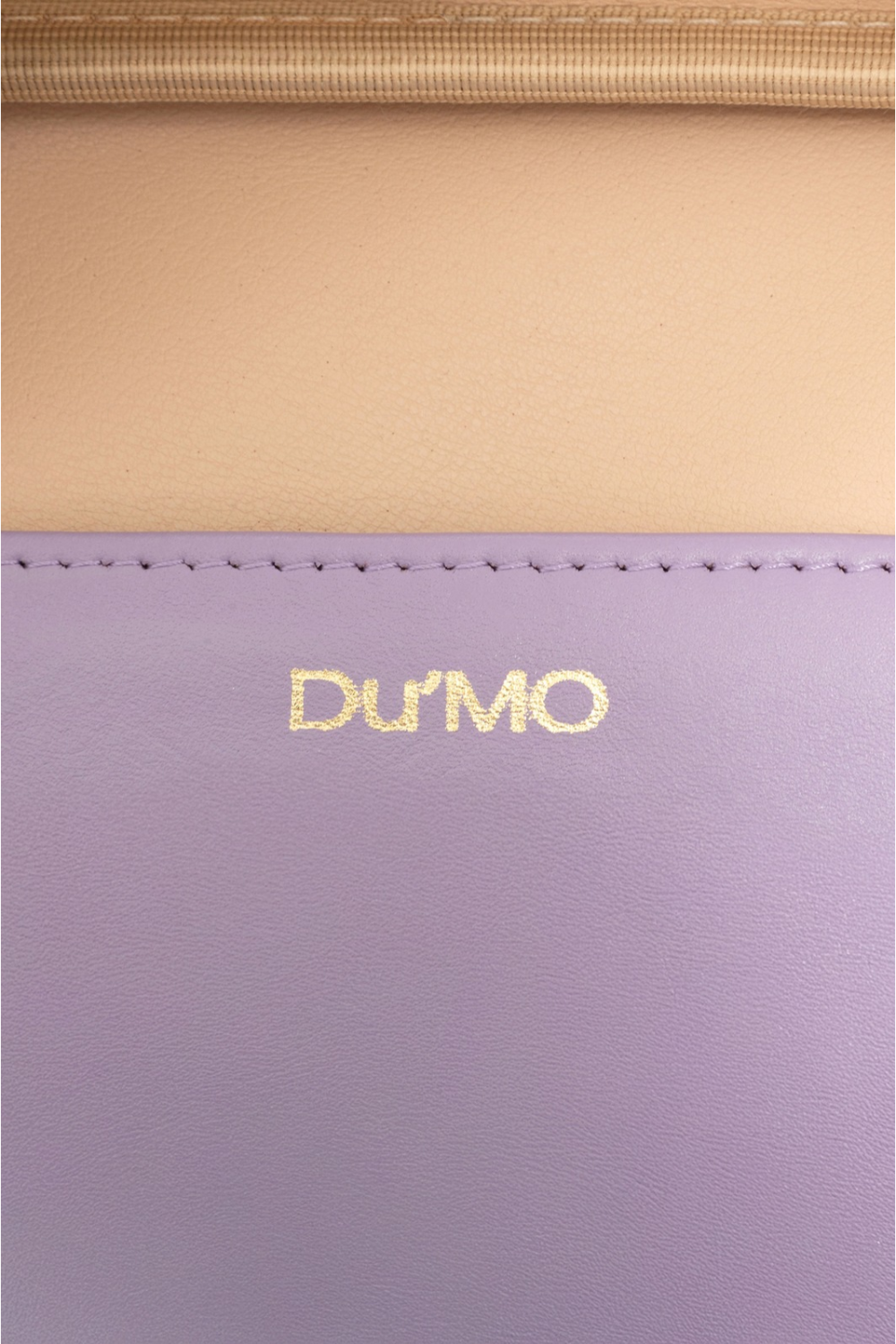 Du'Mo Poise Small Bag detail of the gold Du'Mo logo on lilac leather with cotton lining. Independent Ukrainian designer at MIXMVSE London.
