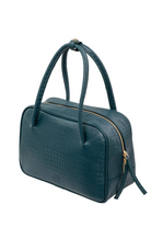 Du'Mo Poise Small Bag in sea wave crocodile-embossed leather. Three-quarter view showing the gold two-way zip. Independent Ukrainian designer at MIXMVSE London.