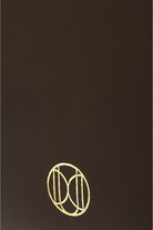 Du'Mo Poise Small Bag close-up of the gold Du'Mo monogram on brown calf leather. Independent Ukrainian designer at MIXMVSE London.
