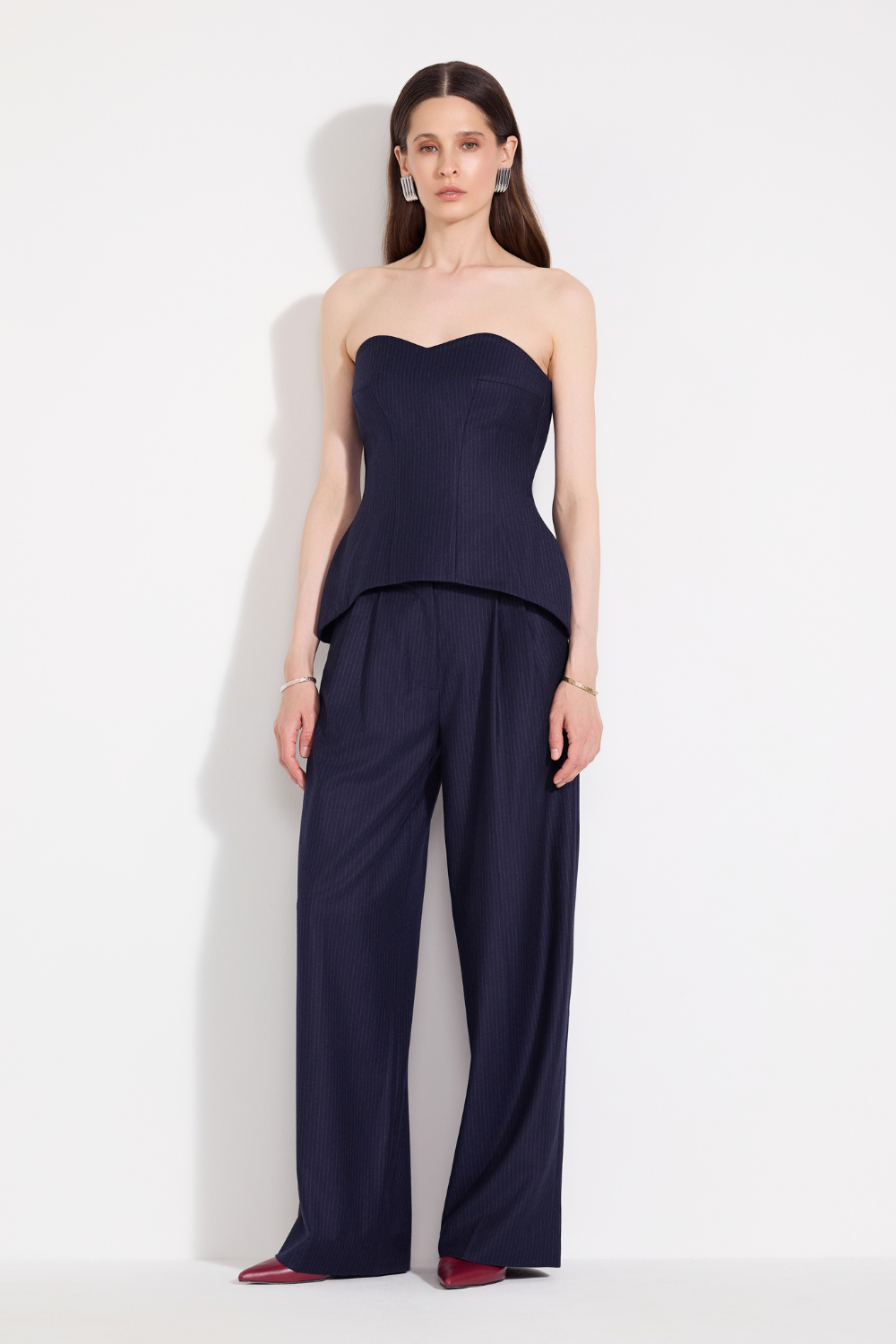 L'eskizzo navy pinstripe wool look: Fez off-shoulder corset with pinstripe palazzo trousers. Independent Ukrainian designer at MIXMVSE London.
