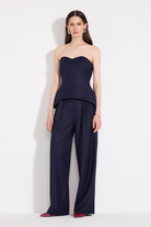 L'eskizzo navy pinstripe wool look: Fez off-shoulder corset with pinstripe palazzo trousers. Independent Ukrainian designer at MIXMVSE London.