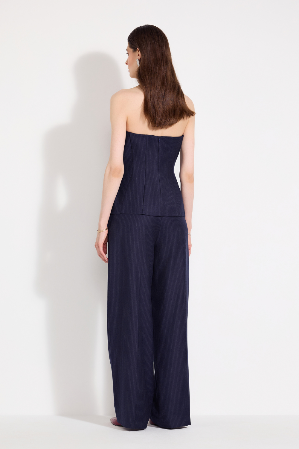 L'eskizzo navy pinstripe corset and palazzo trousers styled together. Independent Ukrainian designer at MIXMVSE London.