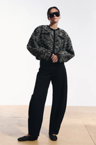 Ambitna barrel-leg trousers in black with rounded volume through the leg. Independent Ukrainian designer at MIXMVSE London.