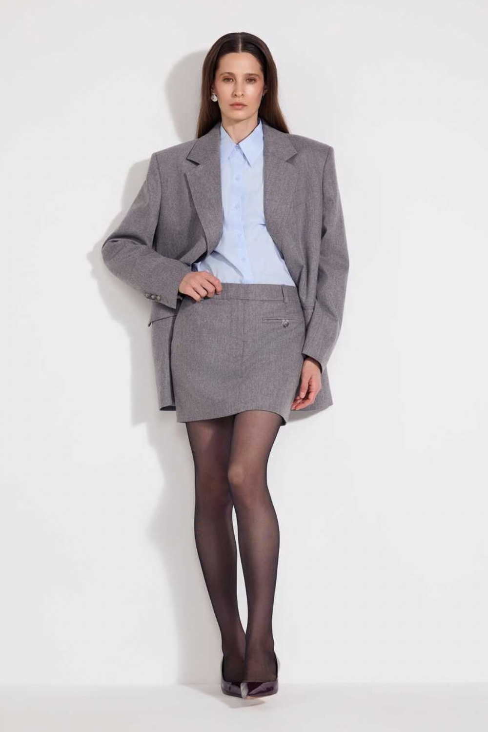 L'eskizzo NantesAsh wool mini skirt in ash grey with trompe-l'oeil trouser-top detail. Independent Ukrainian designer at MIXMVSE London.