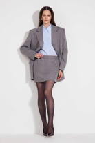 L'eskizzo NantesAsh wool mini skirt in ash grey with trompe-l'oeil trouser-top detail. Independent Ukrainian designer at MIXMVSE London.