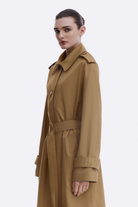 Ambitna beige cotton trench coat, styled look. Independent Ukrainian designer at MIXMVSE London.