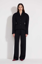 L'eskizzo Bazelnero wool blazer in black with notched lapels and volume sleeves. Independent Ukrainian designer at MIXMVSE London.