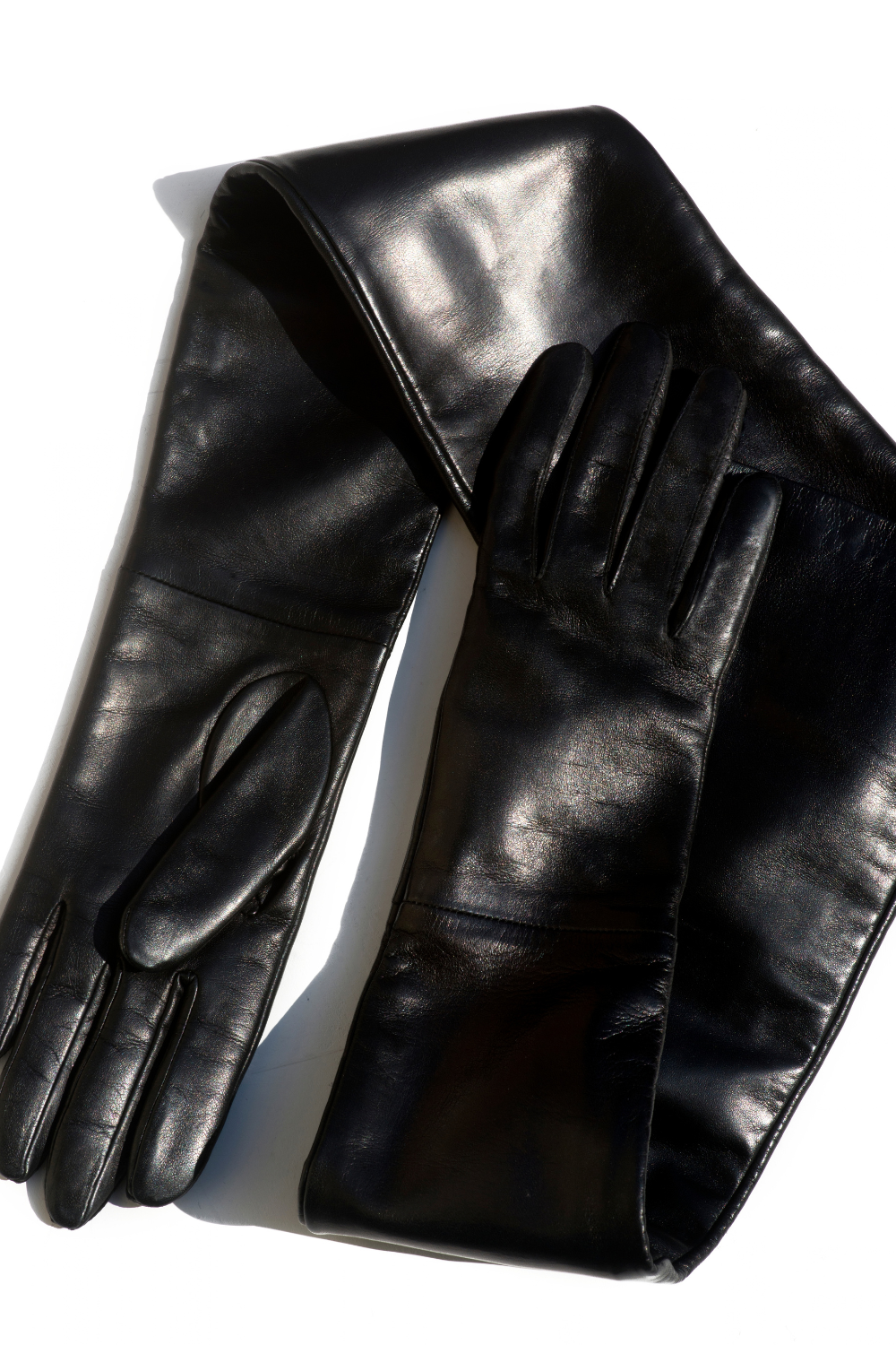 TO BE Accessories black leather evening gloves with red silk-linen lining. Independent Ukrainian designer at MIXMVSE London.