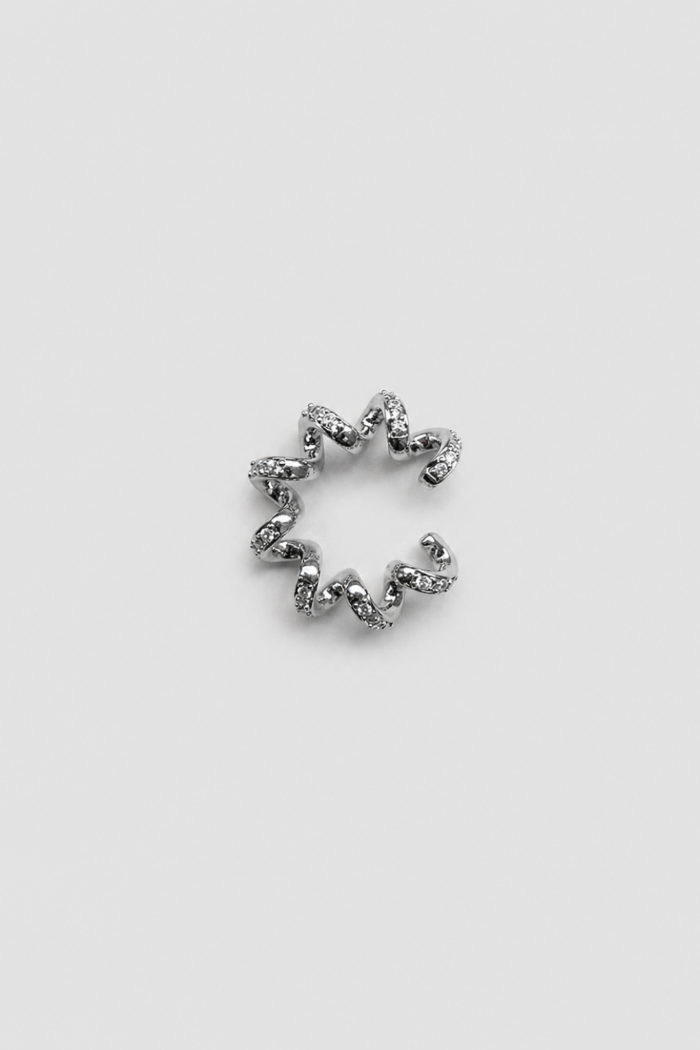 Chuk Spiral ear cuff in silver rhodium-plated brass with cubic zirconia. Ukrainian designer jewellery at MIXMVSE London.