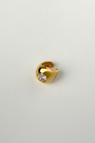 Chuk Bold Drop No. 2 ear cuff in 18K gold-plated brass with cubic zirconia. Ukrainian designer jewellery at MIXMVSE London.