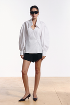 Ambitna white cotton shirt with wide sleeves, front view. Independent Ukrainian designer at MIXMVSE London.