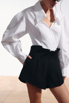 Ambitna white cotton shirt and black wool mini shorts, full look. Independent Ukrainian designer at MIXMVSE London.
