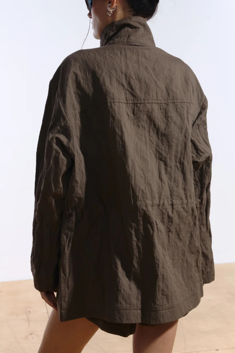 Ambitna crinkled khaki jacket, styled with the drawstring waist cinched. Independent Ukrainian designer at MIXMVSE London.