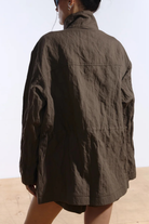 Ambitna crinkled khaki jacket, styled with the drawstring waist cinched. Independent Ukrainian designer at MIXMVSE London.