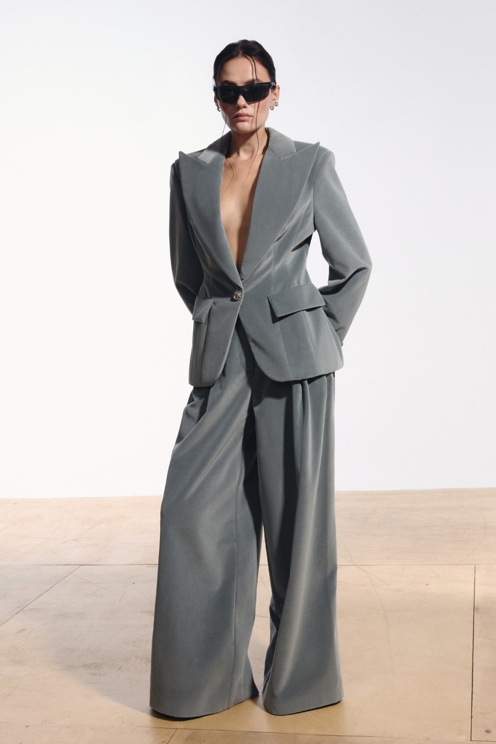 Ambitna grey wool velvet suit, structured blazer with padded shoulders worn with matching trousers. Independent Ukrainian designer at MIXMVSE London.