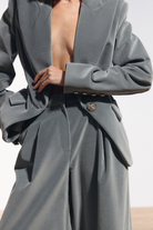 Ambitna grey wool velvet suit, blazer and high-waisted trousers styled together. Independent Ukrainian designer at MIXMVSE London.