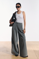 Ambitna velvet trousers in grey wool, front view of the relaxed high-waisted silhouette. Independent Ukrainian designer at MIXMVSE London.
