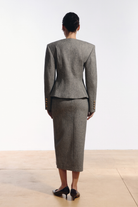 Ambitna grey tweed jacket, detail of the gold buttons on the front closure. Independent Ukrainian designer at MIXMVSE London.