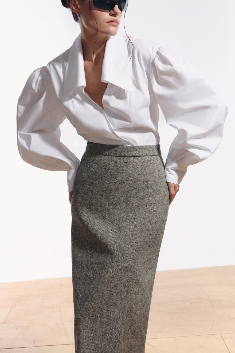 Ambitna grey tweed skirt, side view showing the right side slit. Independent Ukrainian designer at MIXMVSE London.