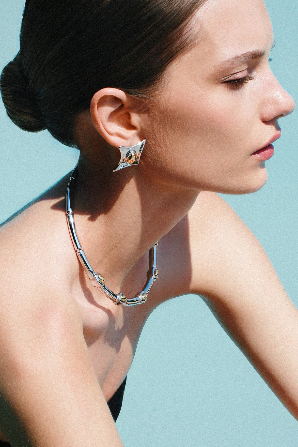 Chuk Form necklace showing the sculptural polished metal. Ukrainian designer jewellery at MIXMVSE London.