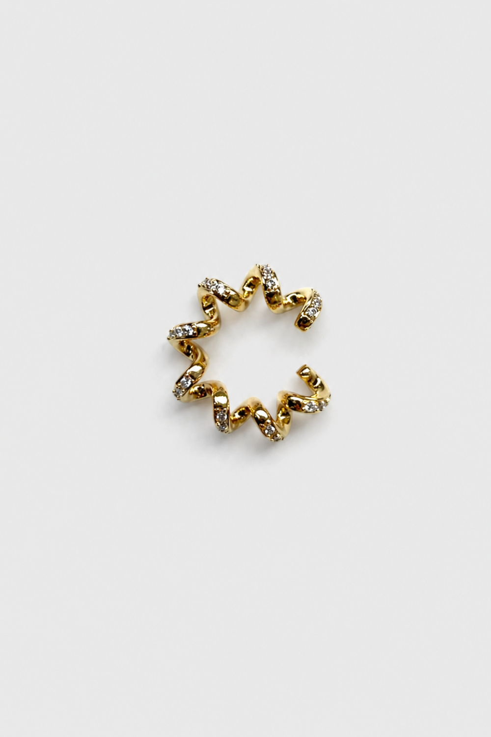 Chuk Spiral ear cuff in gold-gilded brass with cubic zirconia. Ukrainian designer jewellery at MIXMVSE London.