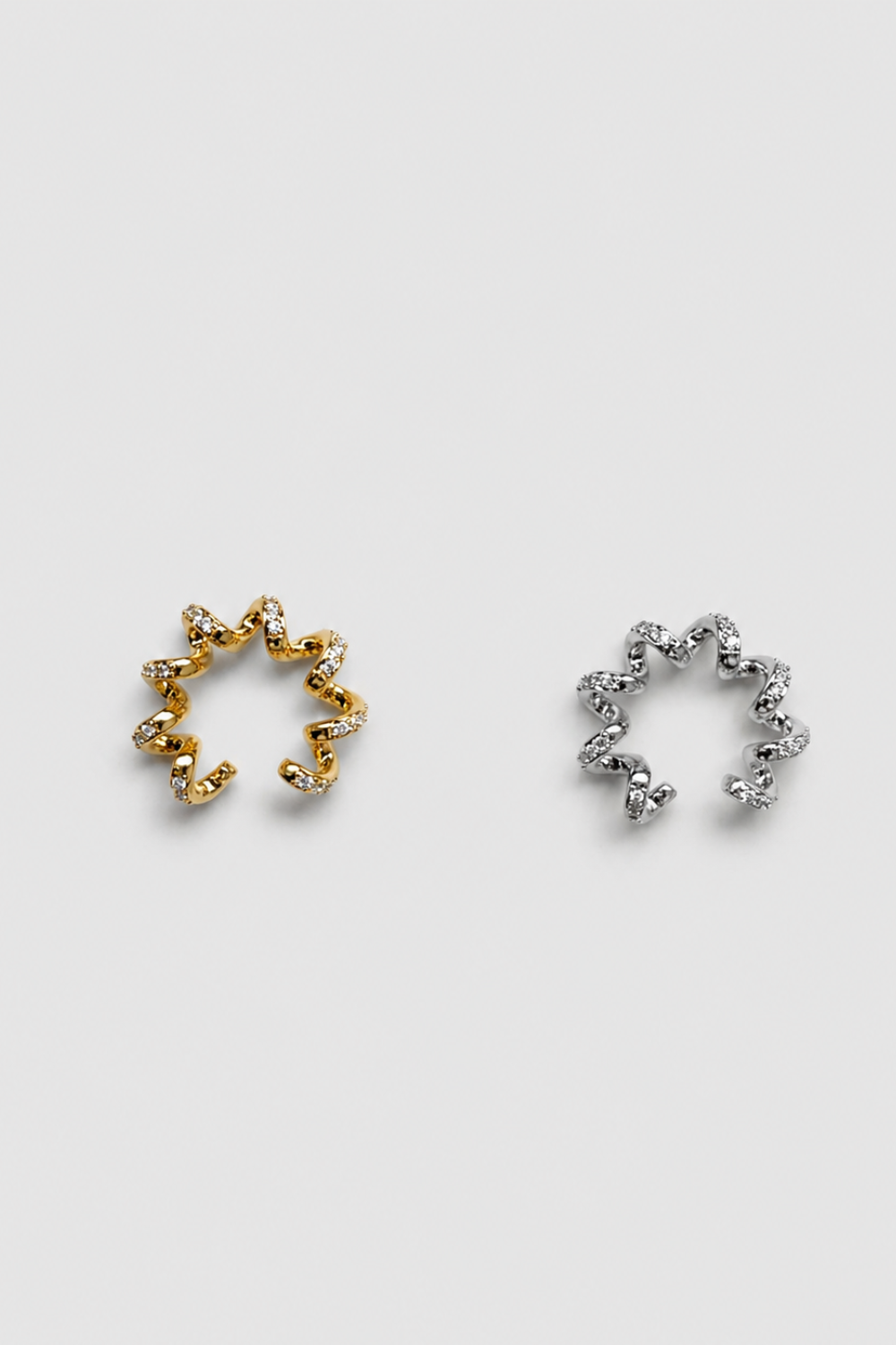 Chuk Spiral ear cuffs in gold and silver, styled together. Ukrainian designer jewellery at MIXMVSE London.