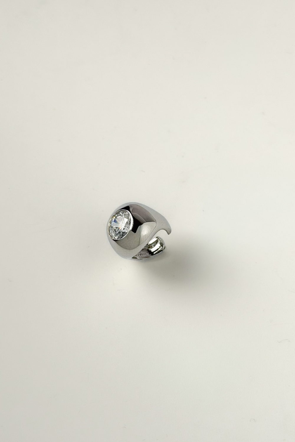 Chuk Bold Drop No. 1 ear cuff in silver rhodium-plated brass with cubic zirconia. Ukrainian designer jewellery at MIXMVSE London.