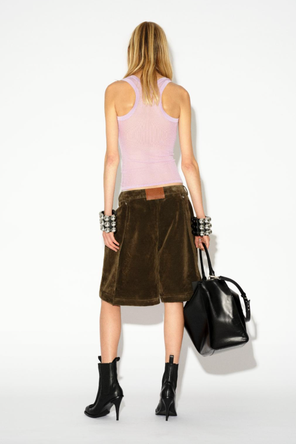 LAFORMELA olive velvet denim shorts styled with a lilac sheer knit tank top. Independent Czech designer from Prague at MIXMVSE London.