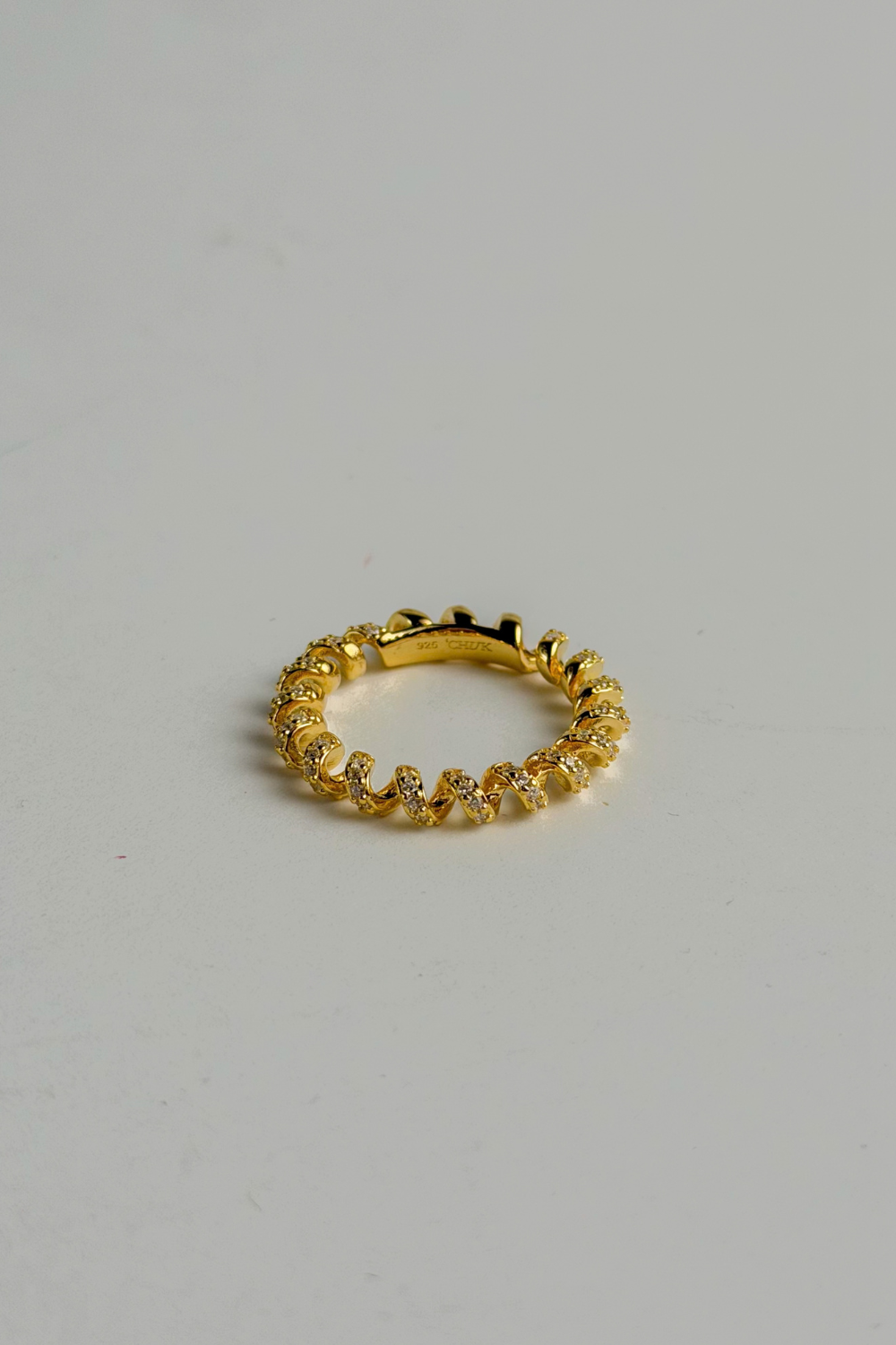 Chuk Spiral ring in 18K gold vermeil on 925 sterling silver with cubic zirconia. Ukrainian designer jewellery at MIXMVSE London.