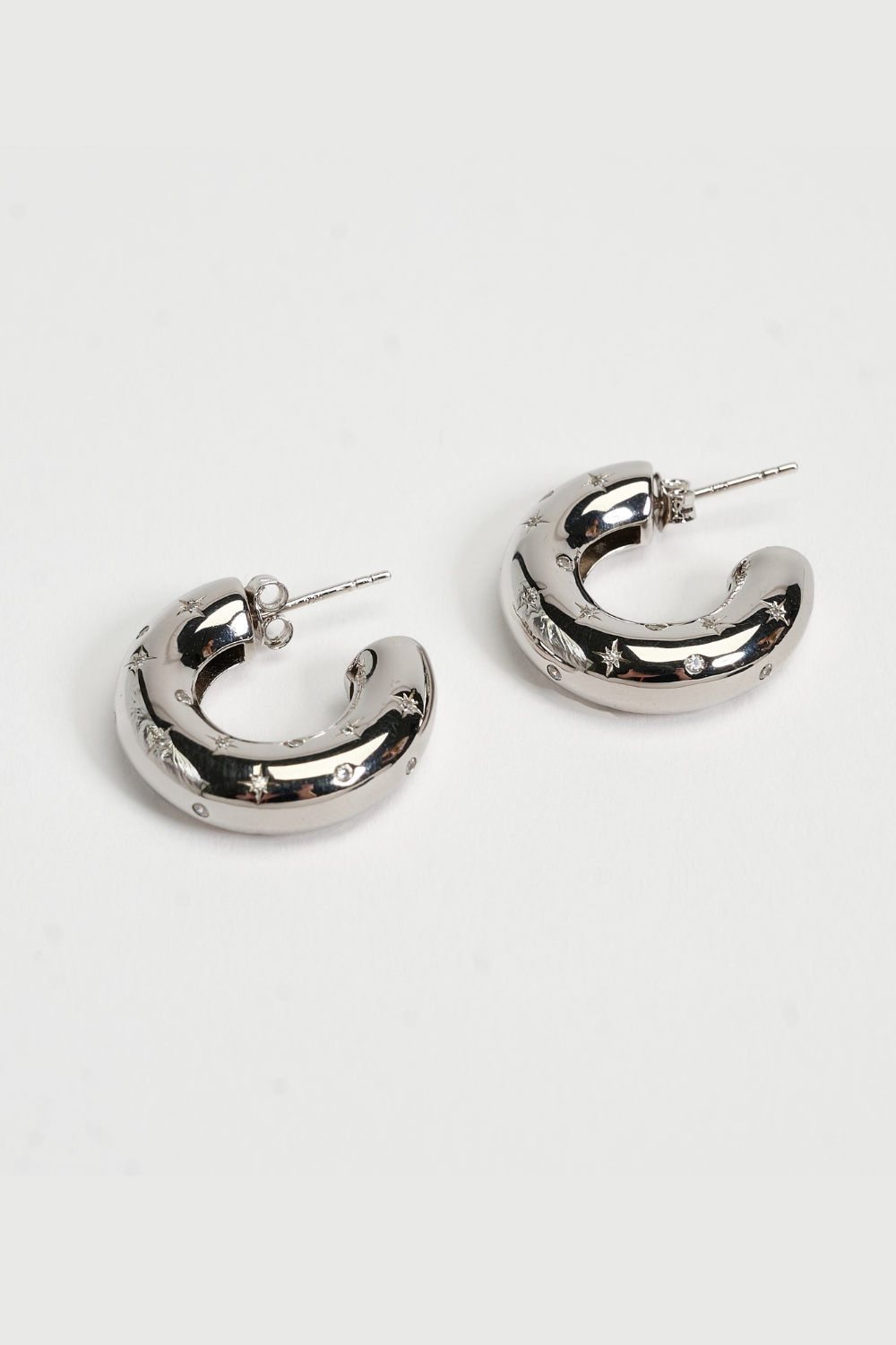 Chuk Raw Desire earrings in rhodium-plated sterling silver with cubic zirconia. Ukrainian designer jewellery at MIXMVSE London.