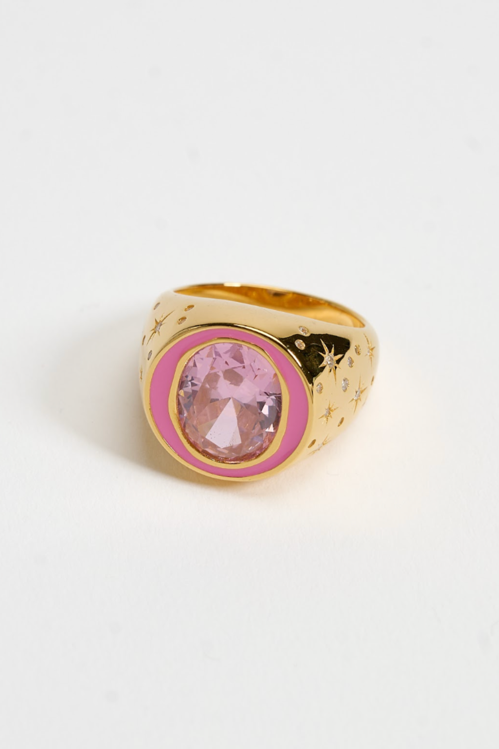 Chuk gold Raw Desire ring with pink stone worn on the hand. Ukrainian designer jewellery at MIXMVSE London.